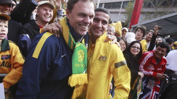 Day of celebration: Holger Osieck and Tim Cahill on Wednesday.