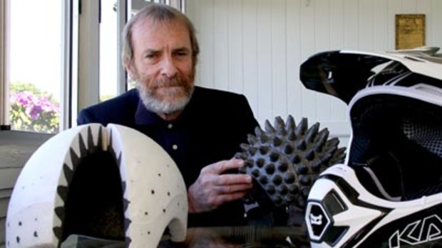 Physicist and inventor Don Morgan with the cone-head design which he invented to line the motocross and bike helmets.