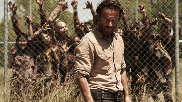 Call this a dream? Rick Grimes (Andrew Lincoln) wanders among the zombies in <i>The Walking Dead</i>.