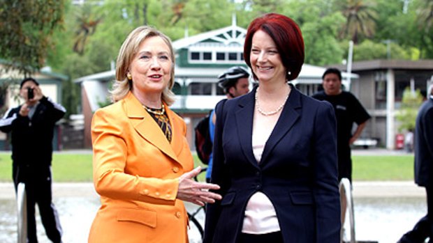 Time out: US Secretary of State Hillary Clinton and Prime Minister Julia Gillard take a moment between meetings for a stroll along the Yarra yesterday.