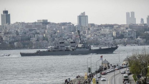Close encounters: US warship USS Donald-Cook sails through the Bosphorus in Istanbul, Turkey, on April 10, 2014, en route to the Black Sea. The ship was repeatedly buzzed by a Russian jet over the weekend,  according to the Pentagon.