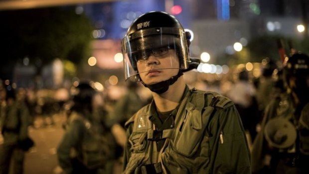 Trained for the fight: A Hong Kong police officer at pro-democracy demonstrations.