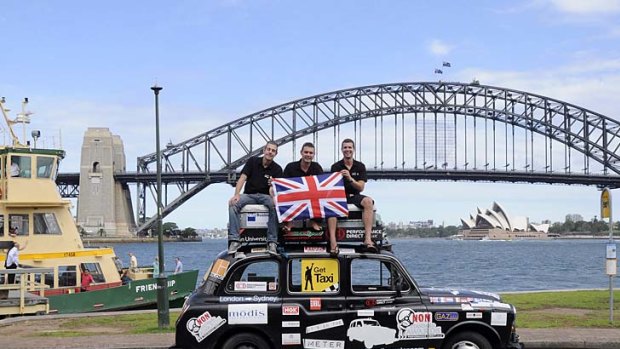 Paul Archer, Johno Ellison and Leigh Purnell on their black taxi.