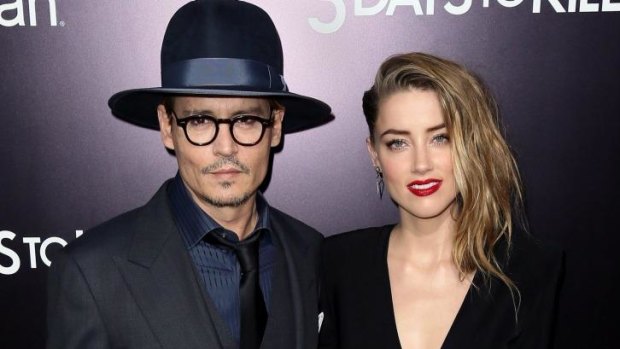 Latest hacking victim: actress Amber Heard with Johnny Depp. 
