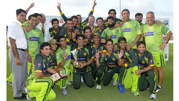 The Pakistan team poses with the trophy after winning the one-day series against the West Indies.