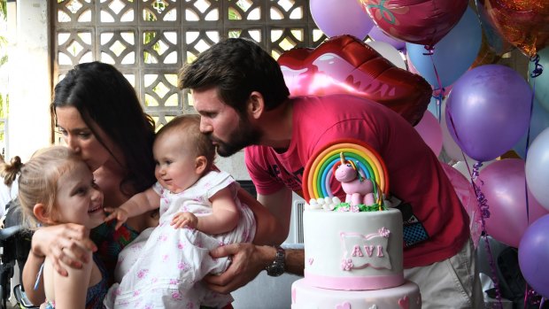 Bethan McElwee and her husband Johnny with Aviana and their niece at Aviana's first birthday party at their home in Darwin.