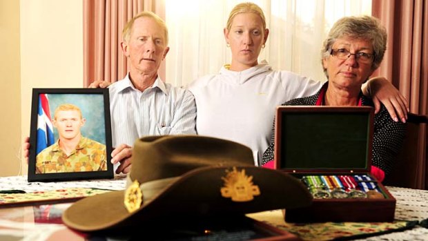 The parents and sister of killed soldier Private Robert Poate, Hugh, left, Janny, right, and their daughter Nicola, centre, in there Garran home.
