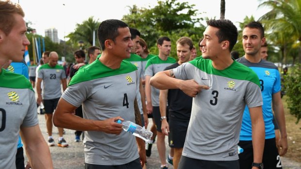 Free to come and go as they please: Jason Davidson, right, talks with Tim Cahill.