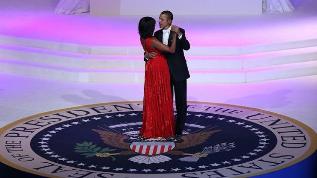 Embracing the future &#8230; Michelle and Barack Obama take to the floor at the Commander-in-Chief Inaugural Ball at the Washington Convention Centre.
