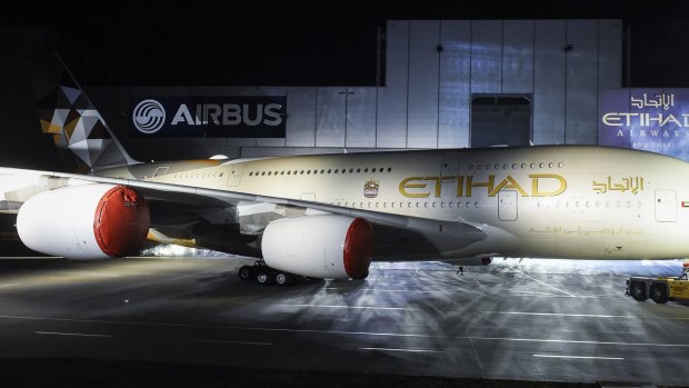 An Airbus A380 rolls out of a paint hangar during a branding ceremony of Etihad Airways at Airbus German headquarters, in Hamburg-Finkenwerder.