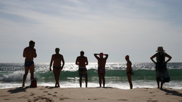 Swimmers hit the beach at Coogee as the mercury rises. 