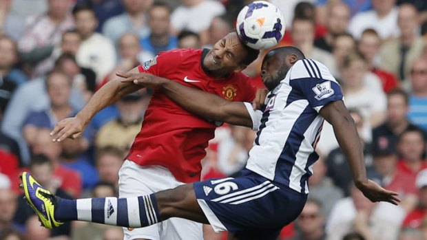 Too good: Manchester United Rio Ferdinand (L) challenges West Bromwich Albion's Victor Anichebe during their English Premier League match at Old Trafford.
