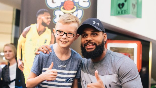 Patty Mills at Belconnen for a book signing for his new book Game Day. Patty Mills congratulates Logan Harrison after Logan beat Mills in a shootout.