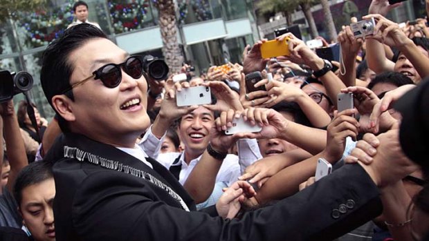 Raking it in ... PSY and his camp will earn at least $US7.9 million this year.