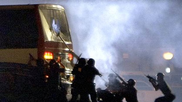 At the sound of gunfire, police storm the bus after a 10-hour standoff.