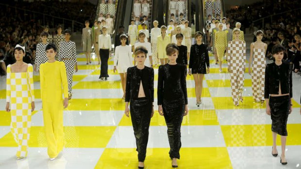 Models present creations by Marc Jacobs' spring-summer parades for Louis Vuitton.