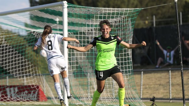 Canberra's Ashleigh Sykes celebrates after scoring against Melbourne Victory at McKellar Park last month, a match delayed an hour due to heat. 
