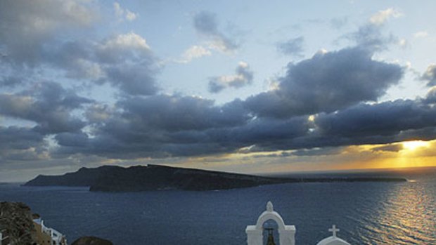 Thirassia Island is seen from the village of Oia in Santorini, Greece. An ideal spot to while away the golden years.