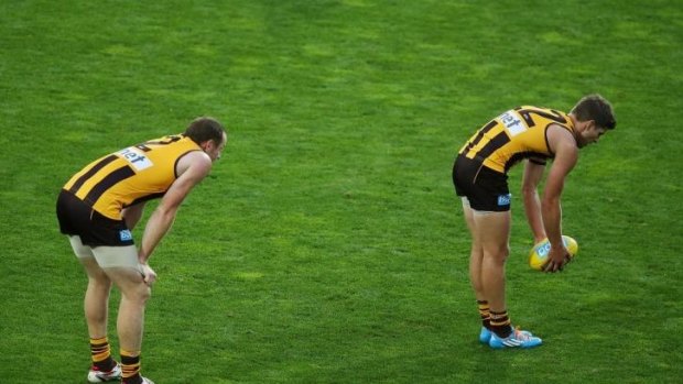 Jarryd Roughead (left) lines up behind Luke Breust in Launceston as he prepares to kick a goal in the match against the Lions on Saturday.