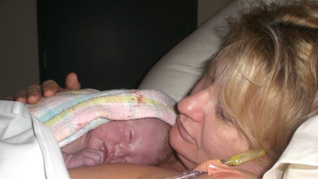 Sonja Jamsek holds her daughter, Summer.