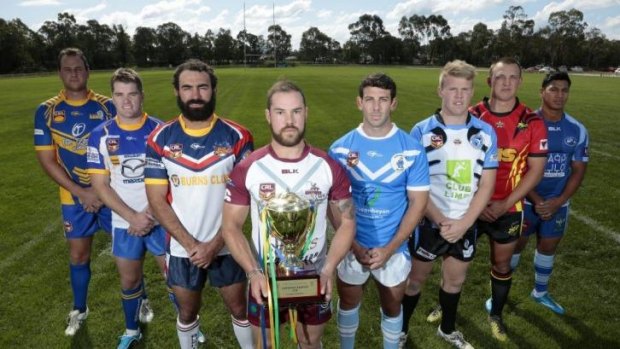 Michael Brophy (third left) and Josh Mitchell (holding trophy) at the Canberra Raiders Cup season launch earlier this year. 