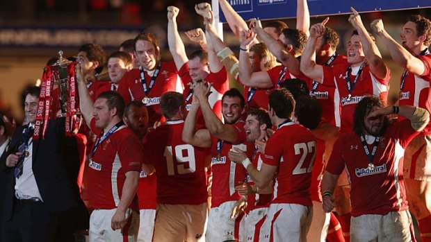 Wales rules: Ryan Jones, who missed the final through injury, and stand-in captain Gethin Jenkins hold the Six Nations trophy aloft.