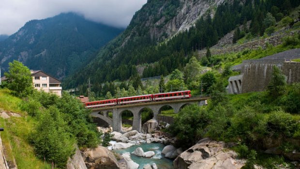 Breath-taking: The Matterhorn-Gotthard bahn train running over the Reuss River.