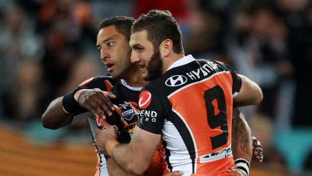 Room to improve ... Benji Marshall is congratulated by Robbie Farah after scoring against the Dragons.