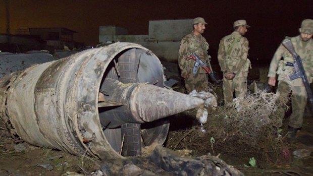 Pakistani soldiers sort through the wreckage of the Boeing 737 passenger plane that crashed near Islamabad, killing all 127 people onboard.