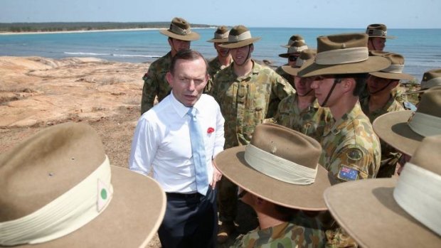 Prime Minister Tony Abbott meets with soldiers in North East Arnhem Land on Thursday.