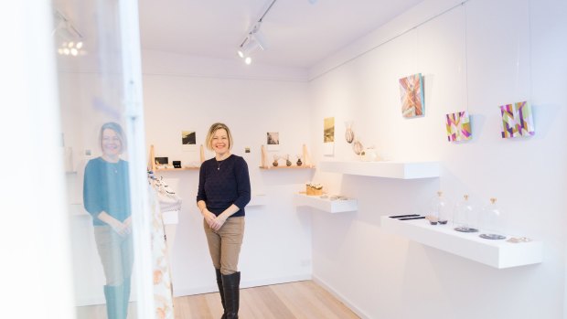 Director Anne Masters inside the Gallery of Small Things.
