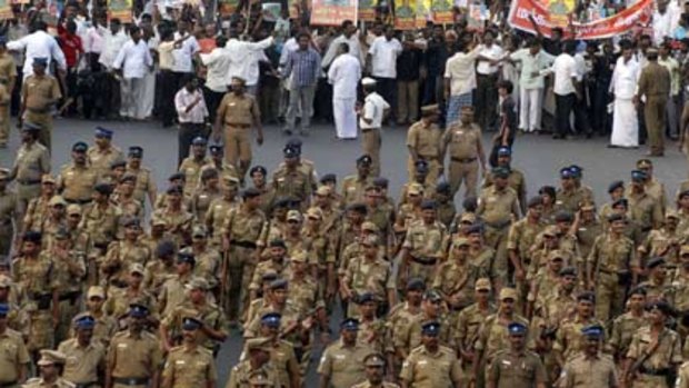 Protestors escorted by police march against the Sri Lankan Government. Picture: Reuters.