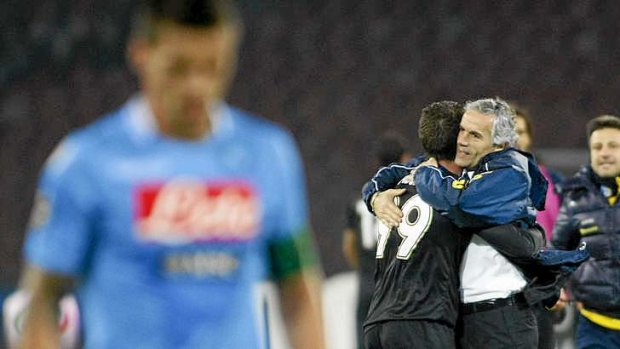 Parma's coach Roberto Donadoni embraces Antonio Cassano after the striker sealed a surprise win.