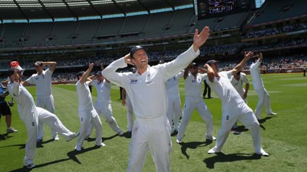 Garden party ... off-spinner Graeme Swann leads his England teammates doing the Sprinkler dance on the MCG after retaining the Ashes yesterday.
