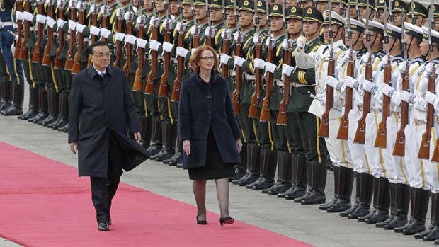 Prime Minister Julia Gillard received a ceremonial welcome with Premier Li Keqiang at the Great Hall of the People in Beijing China.