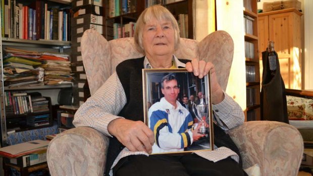 Elizabeth Roebuck, 85, holds a picture of son Peter as she fights to remove shadows hanging over his reputation.