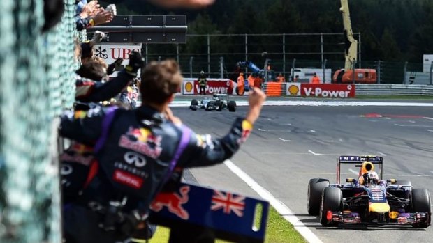 Daniel Ricciardo takes the the chequered flag for his third Grand Prix win.