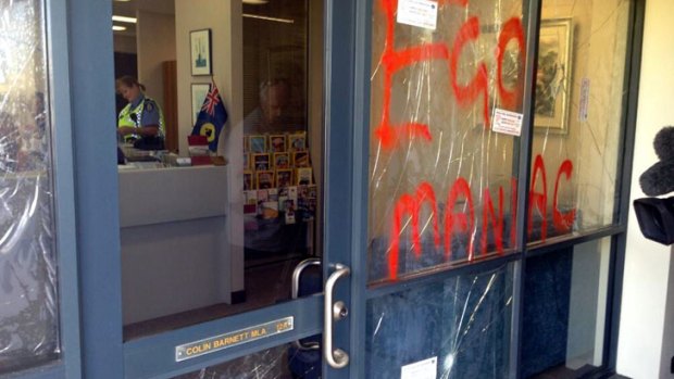 "Egomaniac"  was daubed in red across the office windows.