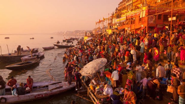 Holy dedication: pilgrims on the Ganges in Varanasi.