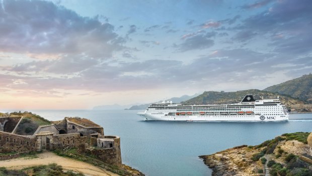 MSC Armonia sails by  Cartagena in Spain. Its mid-ship implant has increased its length to 275 metres. 