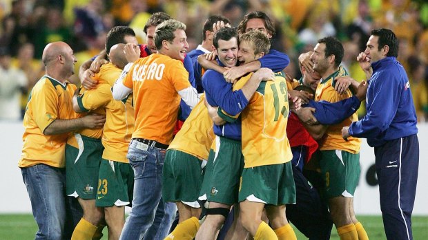 Off to the World Cup: Socceroos celebrate after winning the second leg of the 2006 FIFA World Cup qualifying match between Australia and Uruguay.