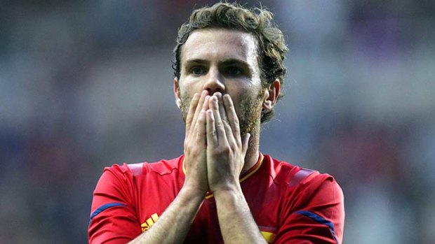 Shocked ... Spain's Juan Mata.