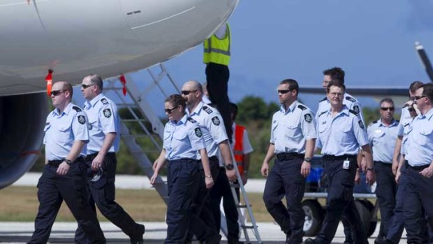 Australian Federal Police arrive at Christmas Island for the first escort of asylum seekers to Malaysia.