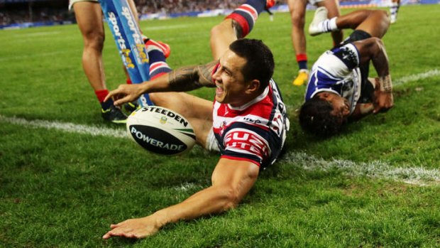 Keen to slay Dragons: Sonny Bill Williams beats Ben Barba to the try line.