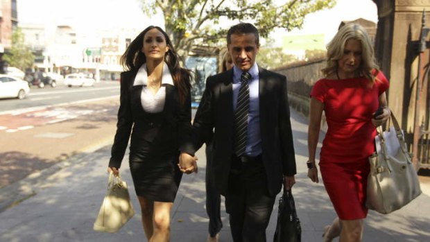 Simon Gittany and his girlfriend, Rachelle Louise, arrive at Darlinghust Supreme Court being approached by journalists from Today Tonight.