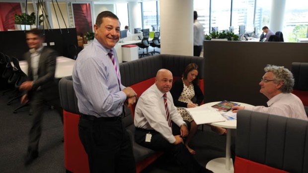 Managing Director ACT of Jones Lang LaSalle, Andrew Balzanelli, left, in the company's Civic office, with some of the staff.