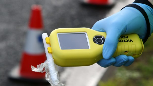 A police officer was almost hit by a car at a breath testing site in Wodonga.