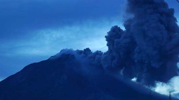 Mount Sinabung volcano spews thick volcanic ash, as seen from Tiga Kicat village, at Karo, North Sumatra, Indonesia, on August 6, 2017. Photo: Jefri Tarigan