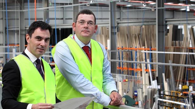 Tim Holding and Opposition leader Daniel Andrews, pictured in April 2012.