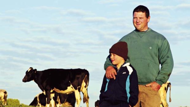 "Look where we live"... Chris Eggert on his Wauchope dairy farm with his son Lachlan.